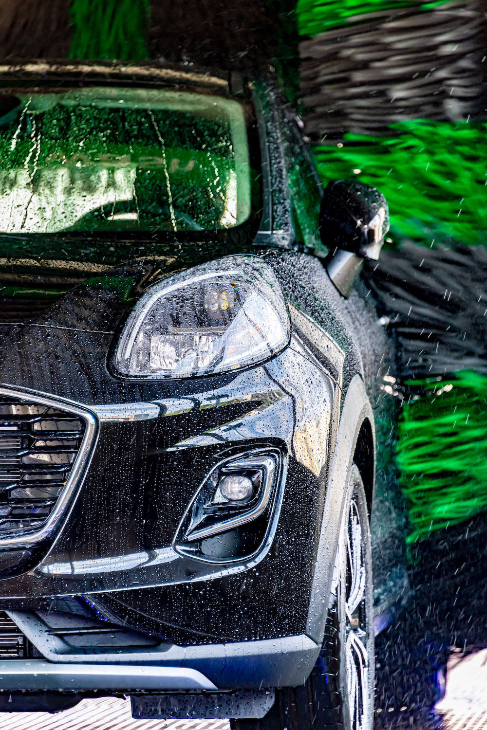 A vehicle in an automatic car wash